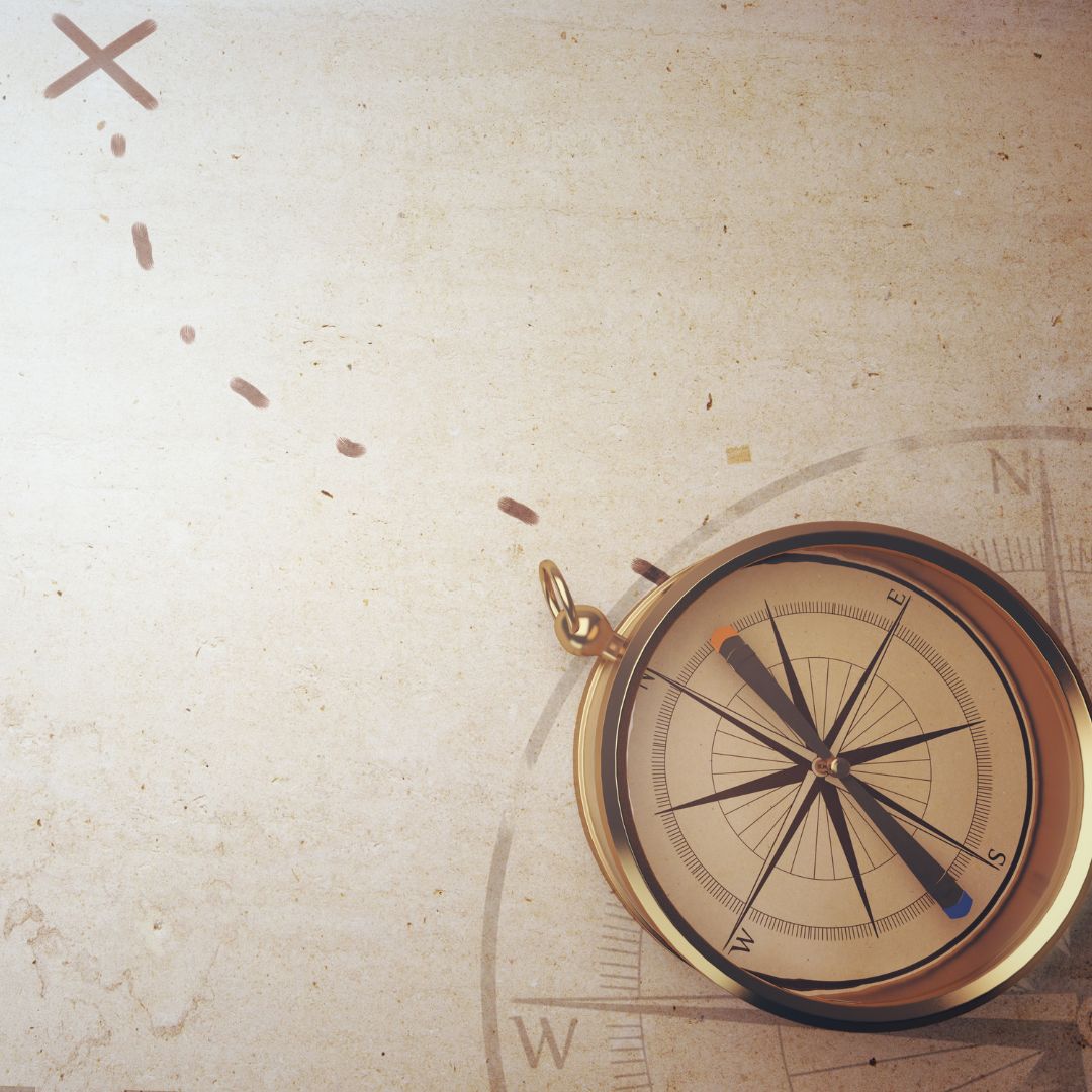 conceptual photo of leadership with a compass and destination